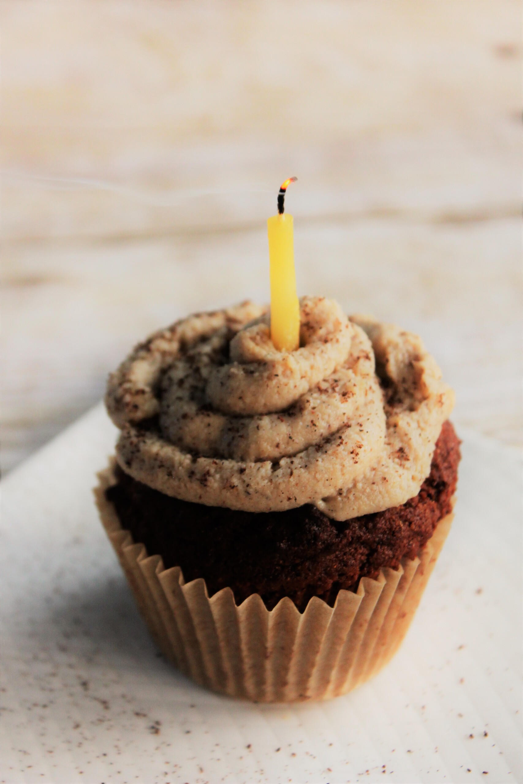 vegan peach cupcake with cashew cream frosting